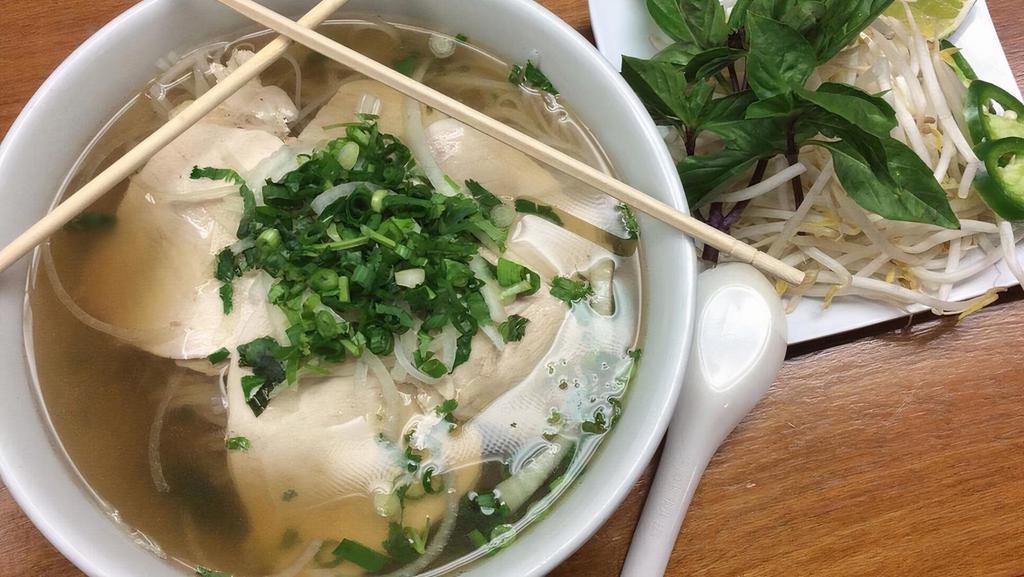 Pho Chicken · Served with beef soup and rice noodles. topped with onions scallions and cilantro.