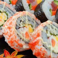 Tri Sushi Cake Roll · Snow crab and sushi rice shaped in sushi box. Topped with tuna, salmon, and yellowtail and s...