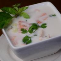 #16. Tom Kha Chicken Soup · Country soup made with sliced chicken breast, tomato, mushroom in a savory coconut milk, kha...