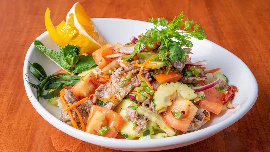 #22. Yum Neur Salad · Sliced, grilled steak spiced with chili peppers, cucumber, cilantro, red onion and lime juice. Served with garden fresh vegetable.