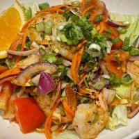 #27. Pla Goong · Grilled shrimp freshly seasoned with lemongrass, chili pepper, cilantro, red onion, and lime...