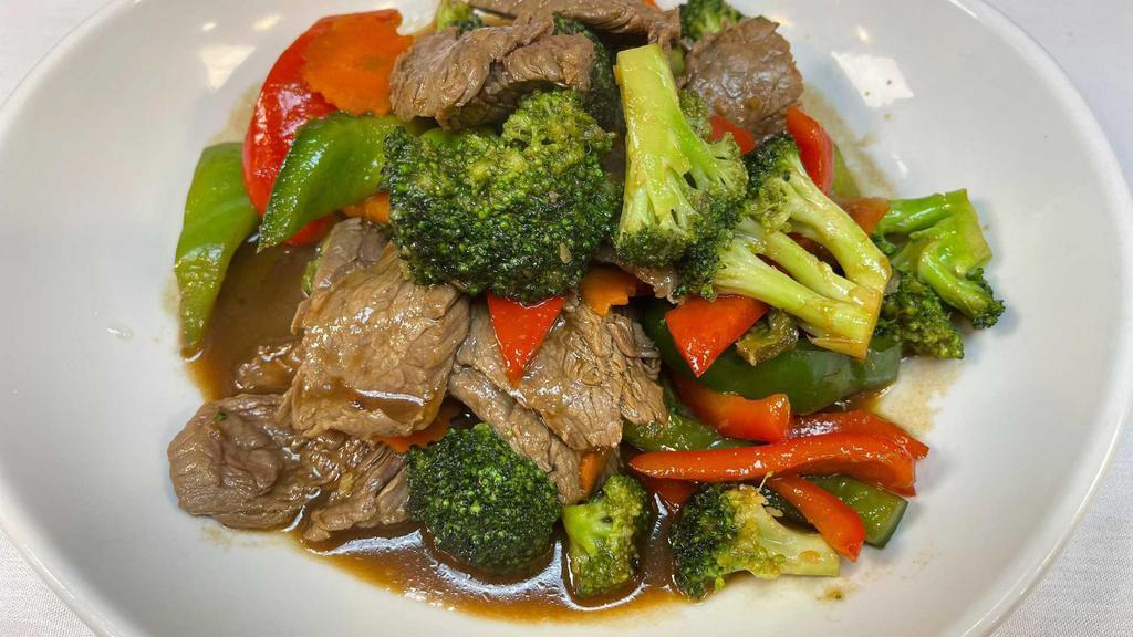 #52. Broccoli Beef · A sumptuous platter of fresh broccoli spears topped with beef, sauteed in our special oyster sauce.