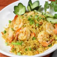#72. Yellow Curry Fried Rice · Fried rice with yellow curry powder, egg, carrot, sweet pea, onion, and spices.