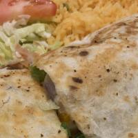 Lunch Fajita Quesadilla · Flour tortilla grilled with steak or chicken, filled with cheese, onions and bell peppers. S...