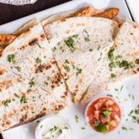 Lunch Chori-Pollo Quesadilla · A flour tortilla stuffed with cheese and grilled chicken and chorizo. Served with rice and s...