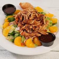 Caribbean Salad · Jerk Chicken, Iceberg-Romaine Mix, Tomatoes, Onions, Jack & Cheddar, Mandarin Oranges, and C...