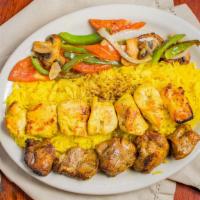 Chicken And Lamb · One skewer of chicken, one skewer of barg with rice and tomatoes.