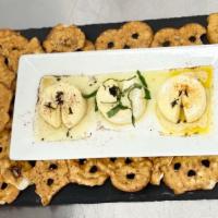 Brie Trio · Three mini baked brie topped with honey and cinnamon; honey and cayenne; and basil served wi...