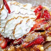 The House · Fresh cut strawberries, Nutella, cookie butter, and housemade whipped cream on our golden Li...