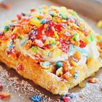 Fruity Pebbles Cereal Waffle · Fruity Pebbles, lemon curd, and housemade whipped cream on our golden Liege waffle.