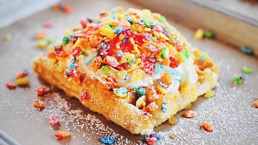 Fruity Pebbles Cereal Waffle · Fruity Pebbles, lemon curd, and housemade whipped cream on our golden Liege waffle.