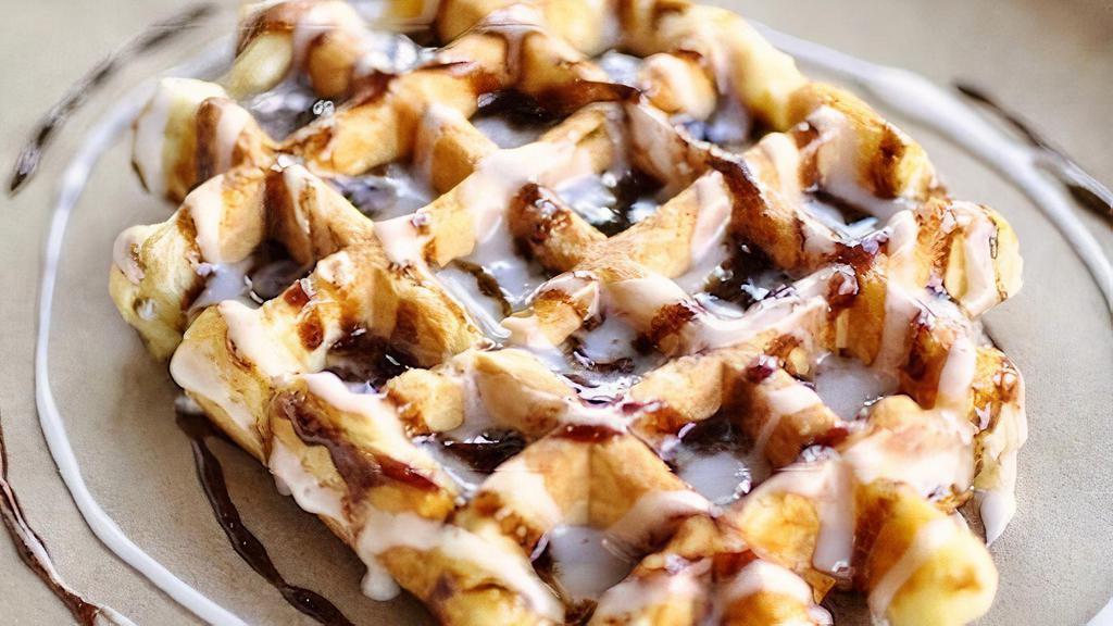 Cinnamon Roll Waffle · Sweet cinnamon glaze and house-made icing on our golden Liege waffle.