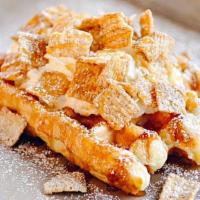 Cinnamon Toast Crunch Cereal Waffle · Cinnamon Toast Crunch, caramel, and housemade whipped cream on our golden Liege waffle.