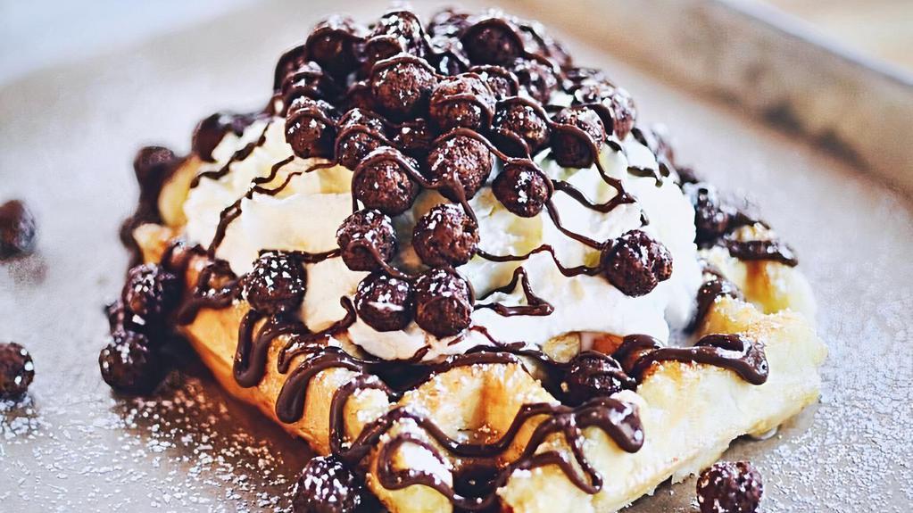 Cocoa Puffs Cereal Waffle · Cocoa Puffs, Nutella, and housemade whipped cream on top of our golden Liege waffle.