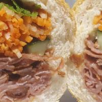 Bbq Pork Banh Mi · Deli style. Dressed with butter aioli, cucumber, pickled carrots, cilantro, jalapeños, onion...