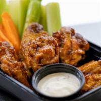 10 Piece Wing · 10 Wings tossed in your choice 1 of our sauces or dry rubs. Served with your choice of ranch...
