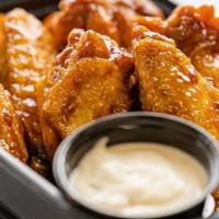 20 Piece Wing
 · 20 Wings tossed and your choice 1 or 2 of our sauces or dry rubs. Served with your choice of...