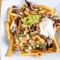 Carne Asada Fries  · Half portion- Grilled steak slices on top of breaded fries. Smothered with queso, sour cream...