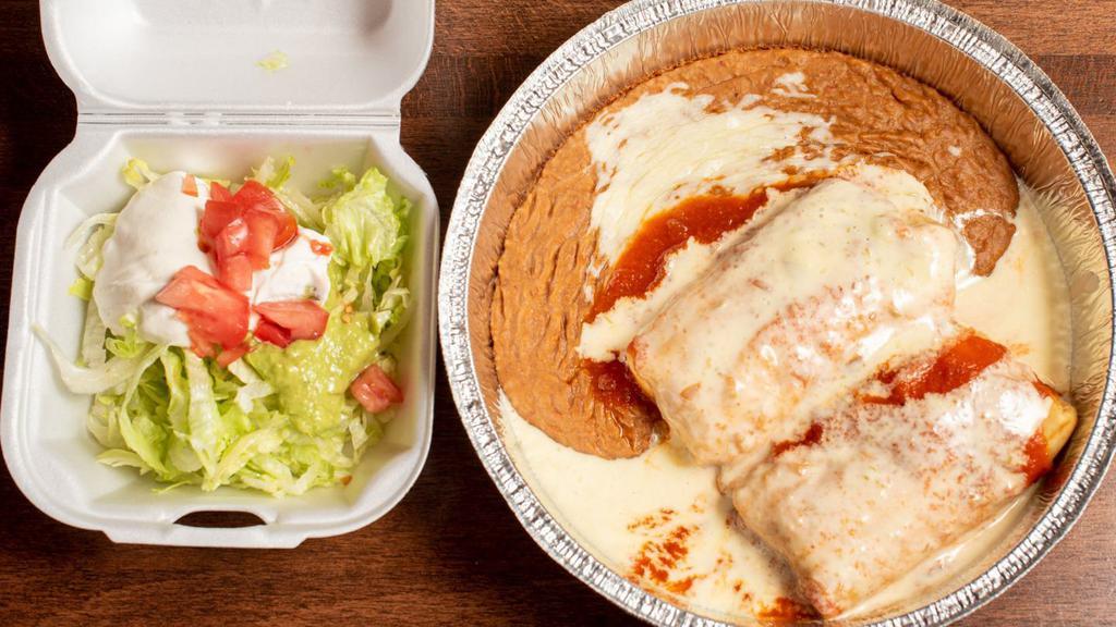 Chimichangas · Two rolled flour tortillas filled with beef tips or chicken, topped with cheese sauce and burrito sauce. Served with guacamole salad, sour cream, tomatoes, and beans.