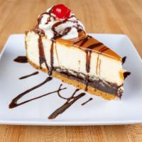 Pecan Turtle Cheesecake  · Our famous New York style cheesecake on a layer of fudge, topped with caramel sauce and garn...