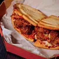Fox'S Meatball · Italian meatballs served on garlic bread covered with pizza cheese, lettuce and spaghetti sa...