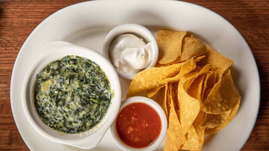 House Cream Spinach · Artichoke hearts with melted monterey jack, salsa, sour cream, and warm tortilla chips.