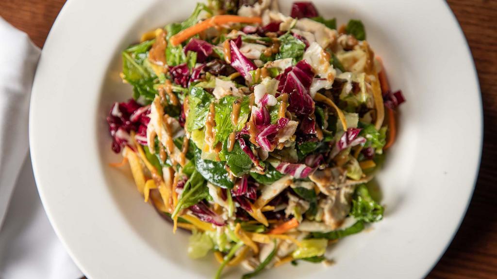 Grilled Chicken Salad · House greens, honey-chili vinaigrette with a touch of Thai peanut sauce.