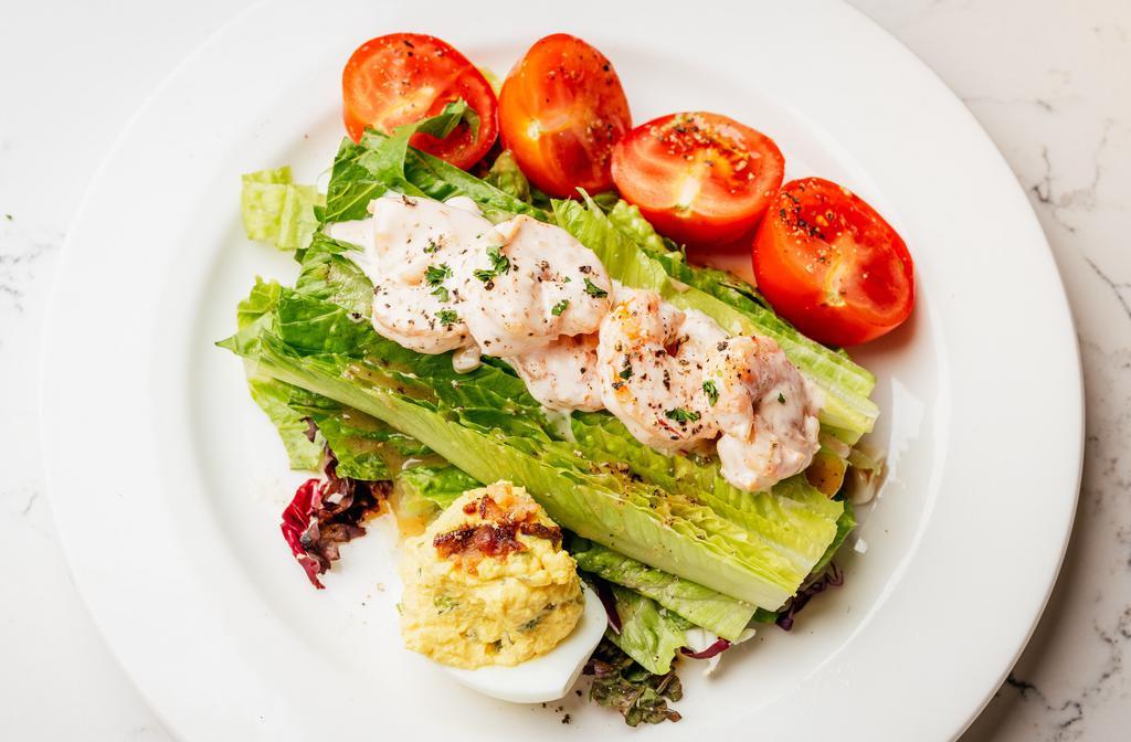 Gulf Shrimp Remoulade Salad · romaine heart, Campari tomatoes, deviled egg, and a 
New Orleans style remoulade