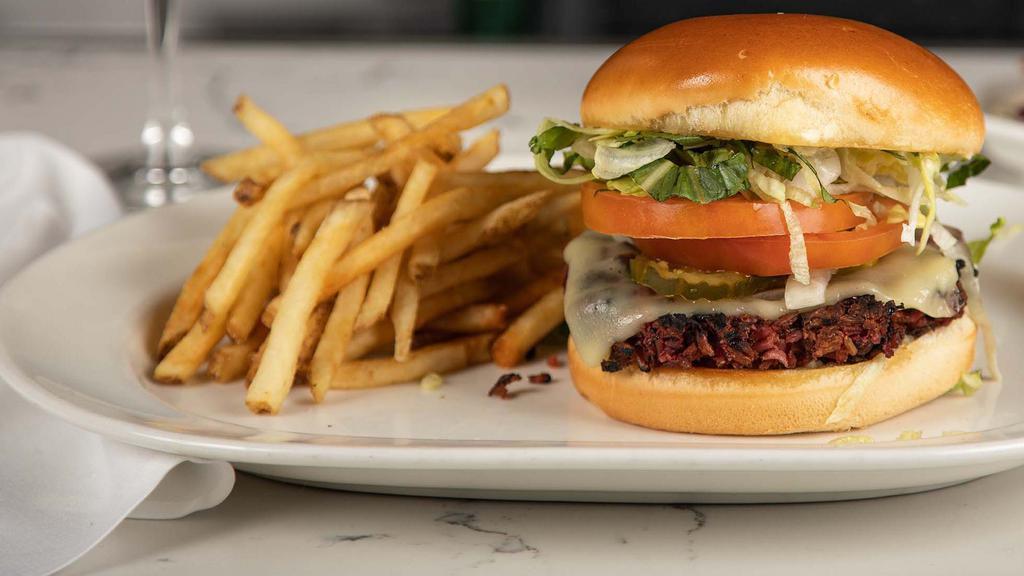 Veggie Burger · Chef’s recipe with Monterey jack, mayo, mustard, lettuce, tomato, pickles, onion and a soy glaze. Comes with a side of French Fries.