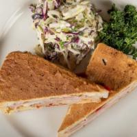 Pressed Cuban · braised pork belly, sliced ham, jack cheese, house-made bread and butter pickles, and mustar...