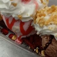 Waffle Cake Split · 3 scoops ice cream, warm waffle cake, your 3 favorite toppings with a cherry