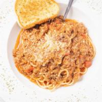 Spaghetti · A big bowl of spaghetti in our flavorful homemade meaty sauce topped with parmesan cheese se...