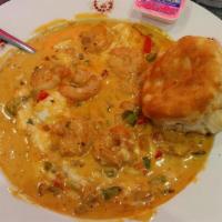 Shrimp & Grits · A delicious combination of our famous creamy grits with 8 shrimp and veggies sautéed in our ...