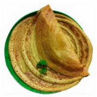 Pesarattu (V) · A traditional South Indian thin and crispy crepe made with green lentil and rice batter.