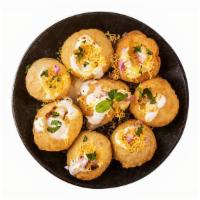 Dahi Puri · Round crispy shell puri filled with beaten yogurt, potatoes, onions, tangy Indian chutneys, ...
