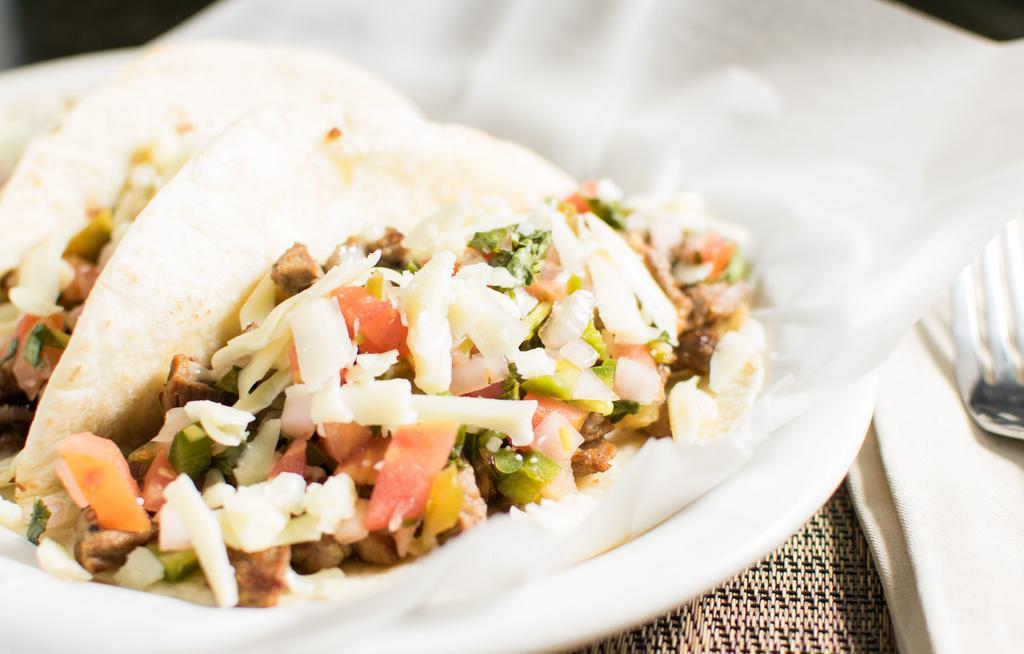 Tacos (3) · Served with pico de gallo and shredded cheese, choose from chicken or steak.