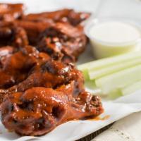 Chicken Wings · 10 pieces, your choice of hot sauce or honey BBQ.