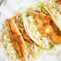 Fish Tacos · 3 flour tortillas stuffed with fish fillet, lettuce, pico de gallo and cheese.