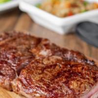 Ribeye (10 Oz) · Rich and full of flavor grilled to perfection.. Served with your choice of 3 sides: brown ri...