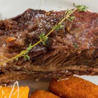 Beef Ribs (10 Oz) · Slow-cooked and grilled to perfection.. Served with your choice of 3 sides: brown rice with ...