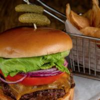 Chima Burger With Chips · The perfect mix of certified Angus beef top sirloin and beef ribs, topped with cheddar chees...