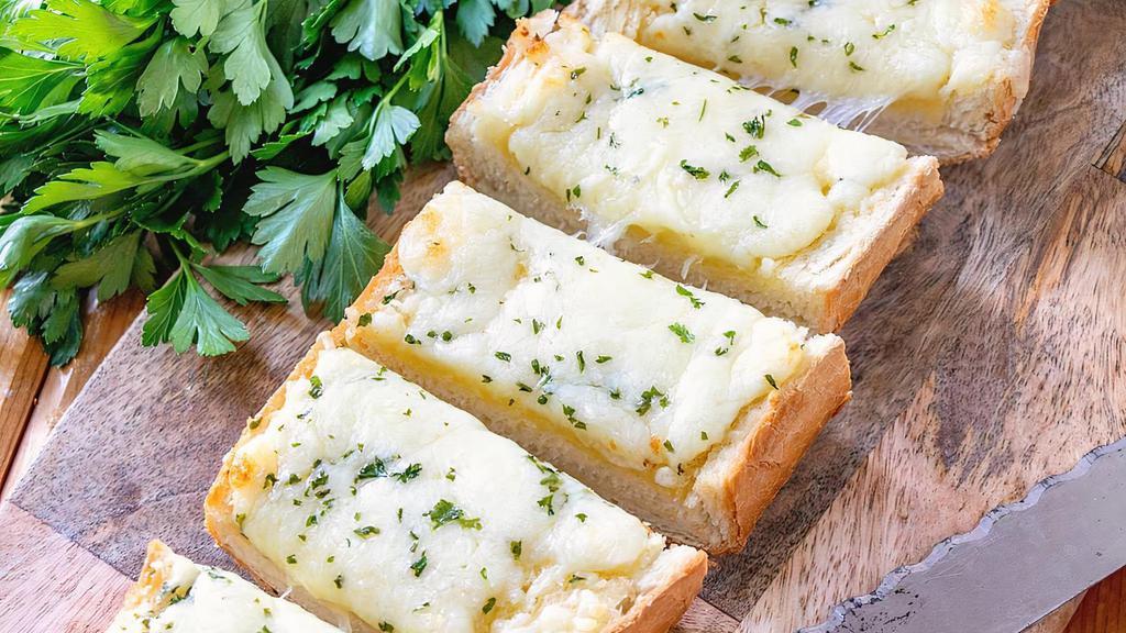 Cheesy Garlic Bread · Served with marinara sauce.