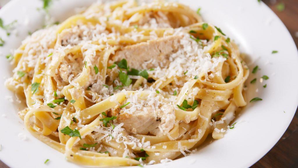 Fettuccine Alfredo With Chicken · Served with a salad and garlic bread