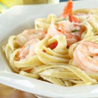 Fettuccine Alfredo With Shrimp · Served with a salad and garlic bread.