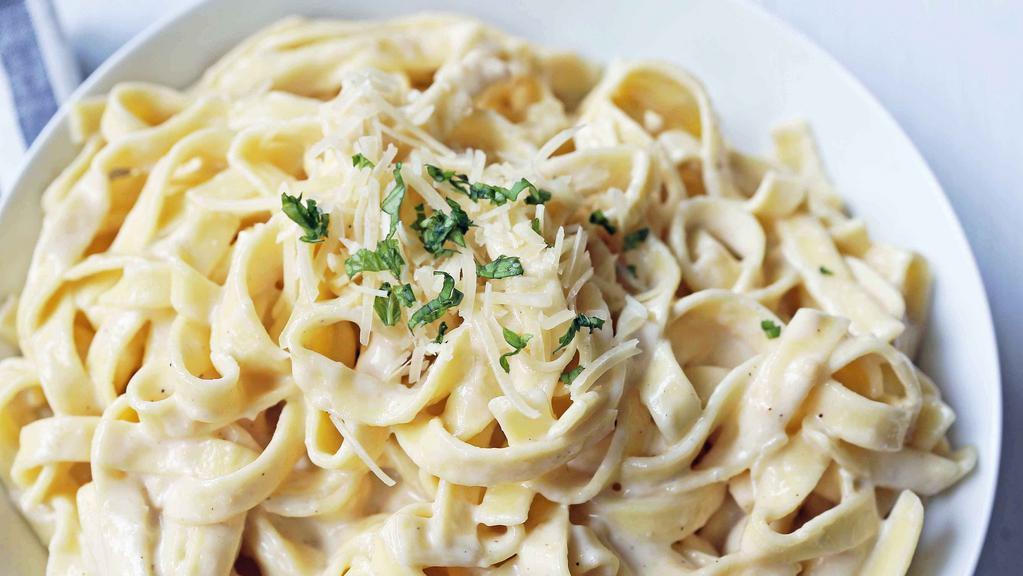 Fettuccine Alfredo With Vegetables · Served with a salad and garlic bread
