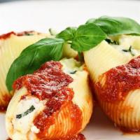 Ny Stuffed Shells · 5 PCS Cheese filled shells with a sprinkle of spices and baked with marinara sauce and Mozza...