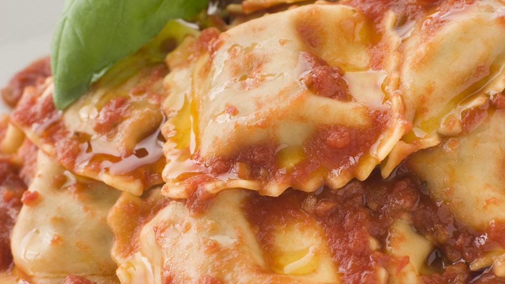 Ny 4 Cheese Ravioli · 5 PCS Cheese filled ravioli with a sprinkle of spices and topped with marinara sauce and Mozzarella cheese. Includes side salad and garlic bread
