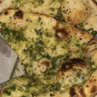 Garlic Naan · Popular Items Teardrop-shaped traditional Punjabi bread seasoned with fresh garlic, baked in...
