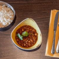 Chana Masala · Chickpeas cooked in spices. Available with bathutra (special bread) with extra charge.
