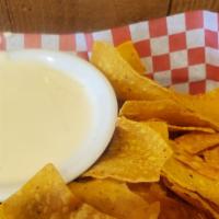 Chips & Queso · Your choice of our homemade Blanco cheese dip or pop's soon-to-be famous cheese dip with a b...